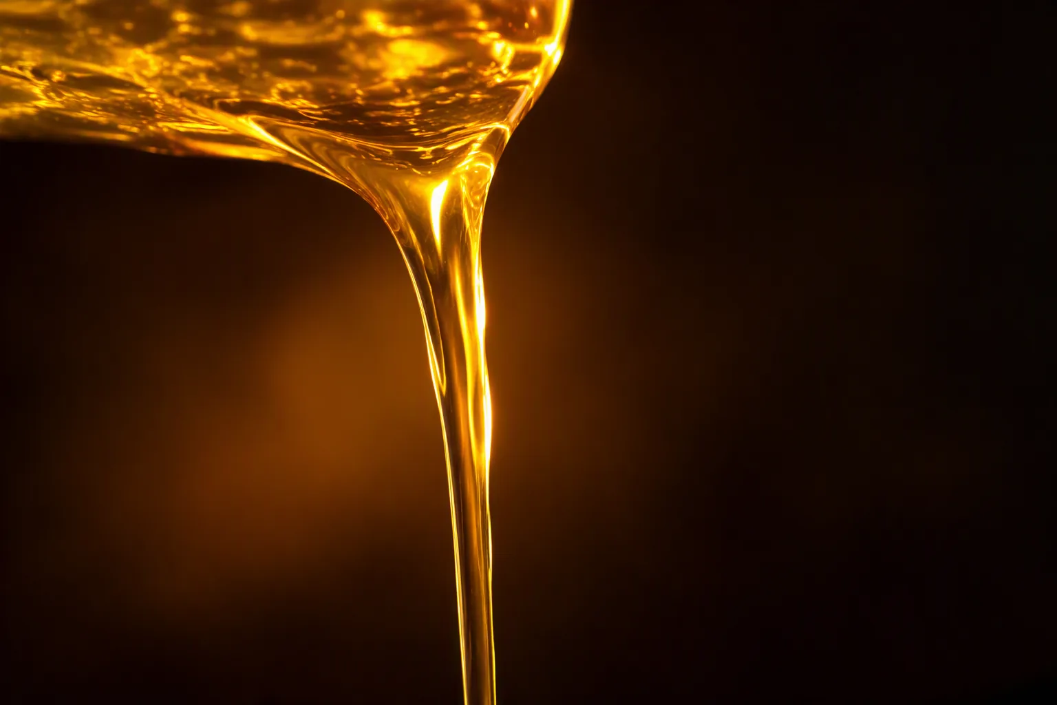 Molten scented wax being poured for wax melt production