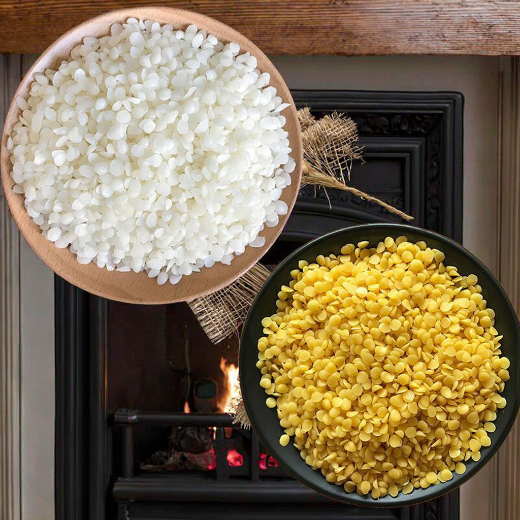 Two bowls of pure beeswax pellets, one white and one yellow